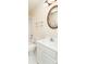 Bathroom featuring a white vanity, decorative mirror, and tub/shower combo at 6271 S Billings Way, Centennial, CO 80111