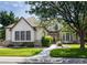 Charming home exterior with stone accents, lush landscaping, and a welcoming walkway at 6271 S Billings Way, Centennial, CO 80111