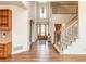 Grand foyer featuring a soaring ceiling, hardwood floors, and an elegant staircase at 6271 S Billings Way, Centennial, CO 80111