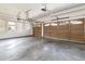 Spacious three-car garage with ample natural light, featuring paneled doors and a clean, modern design at 6271 S Billings Way, Centennial, CO 80111