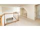 Upstairs hallway with a railing, built-in shelves, and lots of natural light at 6271 S Billings Way, Centennial, CO 80111