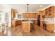 Well-equipped kitchen with wood cabinets, center island, and modern appliances at 6271 S Billings Way, Centennial, CO 80111