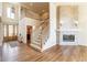 Open living room with hardwood floors, fireplace, and entry view at 6271 S Billings Way, Centennial, CO 80111