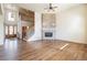 Open living area with hardwood floors, a fireplace, and view to the foyer at 6271 S Billings Way, Centennial, CO 80111