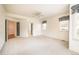 Spacious main bedroom featuring large windows with drapery, carpeted floors, and multiple entryways at 6271 S Billings Way, Centennial, CO 80111