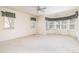 Large main bedroom featuring multiple windows with carpeted floors and a ceiling fan at 6271 S Billings Way, Centennial, CO 80111