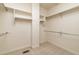 Spacious walk-in closet with carpet flooring and multiple racks for storage at 6271 S Billings Way, Centennial, CO 80111