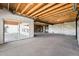 Unfinished basement with concrete flooring and sliding glass doors leading to the outside at 3327 Backdrop Ct, Castle Rock, CO 80108