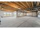 Unfinished basement with exposed wooden beams, concrete floor and multiple windows allowing natural light at 3327 Backdrop Ct, Castle Rock, CO 80108
