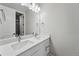 Bathroom featuring a double sink vanity with solid surface counters at 3327 Backdrop Ct, Castle Rock, CO 80108
