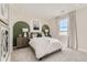 Comfortable bedroom with stylish accent wall, plush carpet, and a window providing ample natural light at 3327 Backdrop Ct, Castle Rock, CO 80108