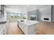 Spacious kitchen with modern appliances, a large center island, and sliding doors leading to an outdoor deck at 3327 Backdrop Ct, Castle Rock, CO 80108