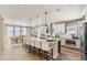 Bright, open kitchen with a large center island, stainless steel appliances, and ample cabinet space at 3327 Backdrop Ct, Castle Rock, CO 80108