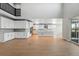 Bright, modern kitchen with a large island, stainless appliances, and an abundance of white cabinets for storage at 3327 Backdrop Ct, Castle Rock, CO 80108