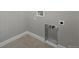 Convenient laundry room with tile flooring and utility connections at 3327 Backdrop Ct, Castle Rock, CO 80108