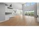 Open-concept living space with a kitchen, dining area, and sliding glass doors to the outdoor space at 3327 Backdrop Ct, Castle Rock, CO 80108