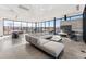 Welcoming living room with high ceilings, a modern fireplace and scenic views through large windows at 3327 Backdrop Ct, Castle Rock, CO 80108