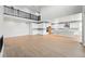 Spacious living room with wood floors, white walls, high ceilings and a modern railing overlooking the space at 3327 Backdrop Ct, Castle Rock, CO 80108