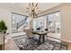 Modern office space with floor-to-ceiling glass walls, with a view of the stairs and living area at 3327 Backdrop Ct, Castle Rock, CO 80108