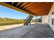 Outdoor patio with concrete floor, staircase and wooden ceiling under the deck of the home at 3327 Backdrop Ct, Castle Rock, CO 80108