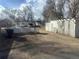 View of the backyard showing detached storage shed and gravel ground cover at 410 Baker St, Longmont, CO 80501