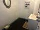 Bathroom with a white vanity and a mirror, showcasing simple fixtures at 410 Baker St, Longmont, CO 80501