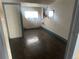 Bedroom with a window, neutral walls and a white door in a modest home at 410 Baker St, Longmont, CO 80501