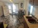 Kitchen area features tile floors, a refrigerator, and an eating area at 410 Baker St, Longmont, CO 80501