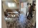 Living room with a leather sofa and a coffee table near the entrance at 410 Baker St, Longmont, CO 80501