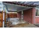 Covered patio with red brick exterior, outdoor entrance, and fenced yard at 3200 W Chenango Ave, Englewood, CO 80110