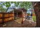 Back patio with pergola, red brick exterior, and outdoor seating area at 3200 W Chenango Ave, Englewood, CO 80110