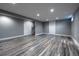 Finished basement area with wood-look floors, recessed lights, closet and additional room at 3200 W Chenango Ave, Englewood, CO 80110