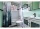 Bathroom with a white tiled shower and a vanity with sink at 3200 W Chenango Ave, Englewood, CO 80110