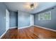 Bedroom view with hardwood floors and two white doors at 3200 W Chenango Ave, Englewood, CO 80110