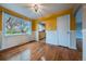 Cozy dining area with hardwood floors, and ample natural light; kitchen view through archway at 3200 W Chenango Ave, Englewood, CO 80110