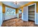 Bright dining room features hardwood floors, large window, and convenient closet space at 3200 W Chenango Ave, Englewood, CO 80110