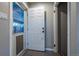 Home entryway with a storm door and tile floor at 3200 W Chenango Ave, Englewood, CO 80110