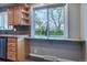 View of kitchen with a breakfast bar overlooking the outside at 3200 W Chenango Ave, Englewood, CO 80110