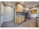 Kitchen view showcasing stainless steel appliances, wood cabinets and granite countertops at 3200 W Chenango Ave, Englewood, CO 80110