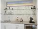 Bar area with open shelving and glass display cases at 4525 N Raleigh St, Denver, CO 80212