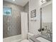 Stylish bathroom with gray tiled shower and modern fixtures at 4525 N Raleigh St, Denver, CO 80212