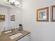 Modern bathroom with a sleek vanity, a large mirror, and tasteful decor at 4525 N Raleigh St, Denver, CO 80212