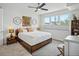 Bright bedroom featuring a comfortable bed, a ceiling fan, and a large window with natural light at 4525 N Raleigh St, Denver, CO 80212
