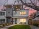 Modern two-story home featuring clean lines, a balcony, and a well-maintained front yard at 4525 N Raleigh St, Denver, CO 80212