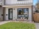 Charming front porch with modern seating and a well-maintained lawn at 4525 N Raleigh St, Denver, CO 80212