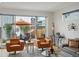 Bright living room with stylish furniture and a sliding glass door leading to an outdoor patio at 4525 N Raleigh St, Denver, CO 80212