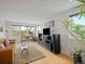 Bright living room with hardwood floors, modern decor, and large windows providing ample natural light at 4525 N Raleigh St, Denver, CO 80212