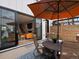 Outdoor patio with seating and an umbrella, seamlessly blending indoor and outdoor living spaces at 4525 N Raleigh St, Denver, CO 80212