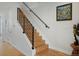 Modern staircase with wood steps and black metal railings, adding a touch of elegance to the home at 4525 N Raleigh St, Denver, CO 80212