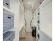 Organized walk-in closet with ample shelving, hanging space, and stylish storage boxes at 4525 N Raleigh St, Denver, CO 80212
